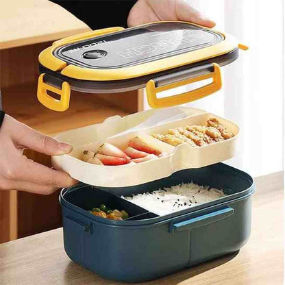 Démonstration du système à deux étages de la lunch box éco-étanche avec un compartiment pour le riz et un plateau séparé pour les accompagnements