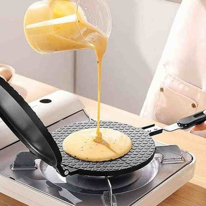 Versage de pâte à crêpe sur la plaque chauffante antiadhésive d'une crêpière électrique HautPerformance.
