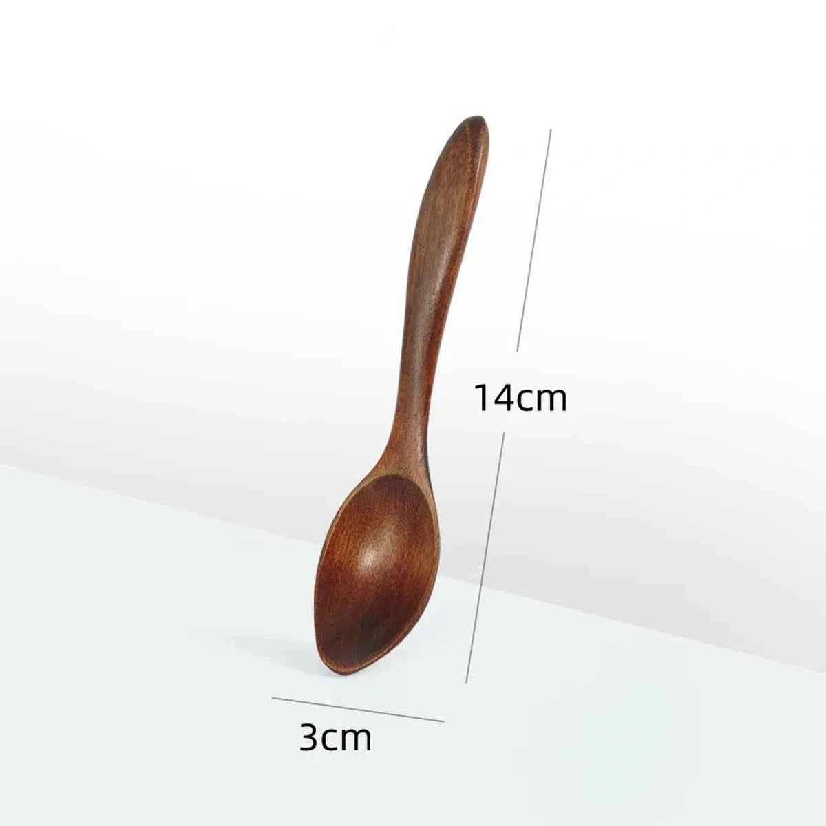 Schéma de dimensions d'une cuillère à café en bois foncé indiquant une longueur de 14 cm et une largeur de 3 cm.